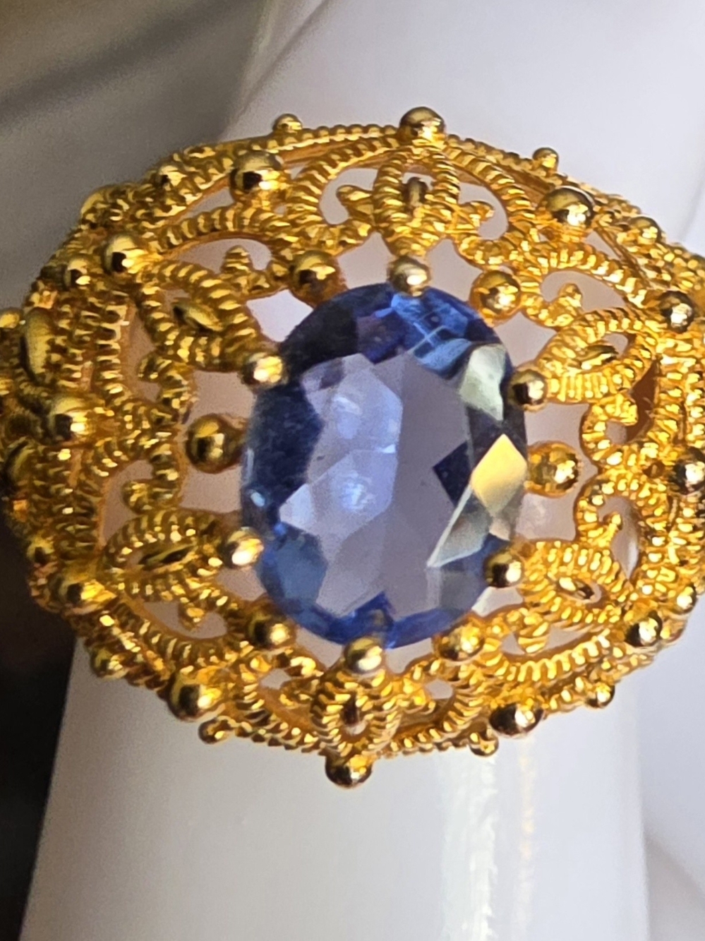 Ornate Gold Filigree Ring with Blue Oval Gem
